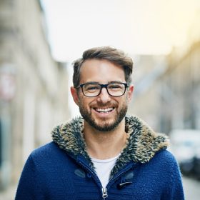 Portrait of a handsome young man outside